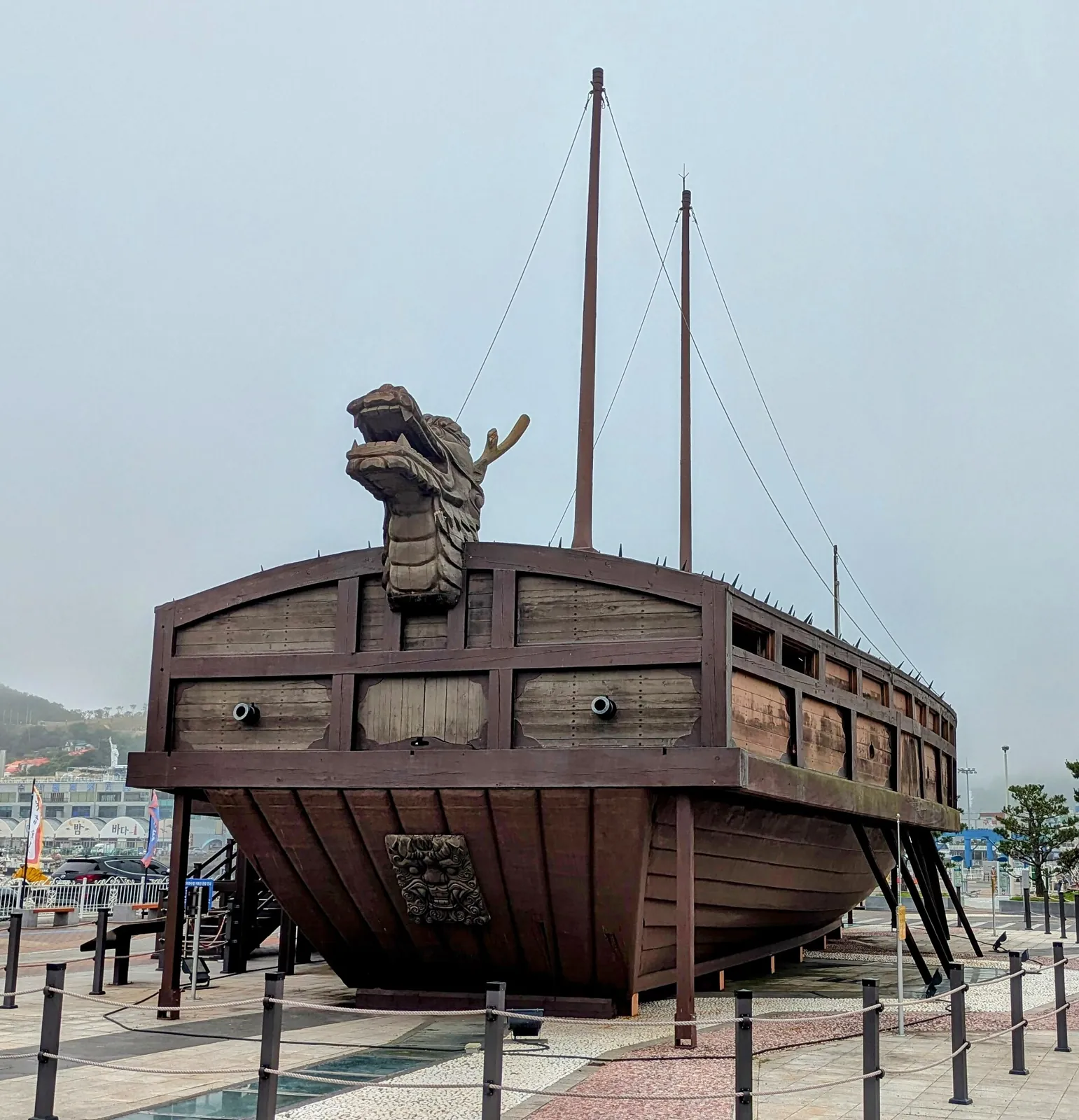 Reconstructed Korean turtle ship with a dragon head on display on a Yeosu waterfront